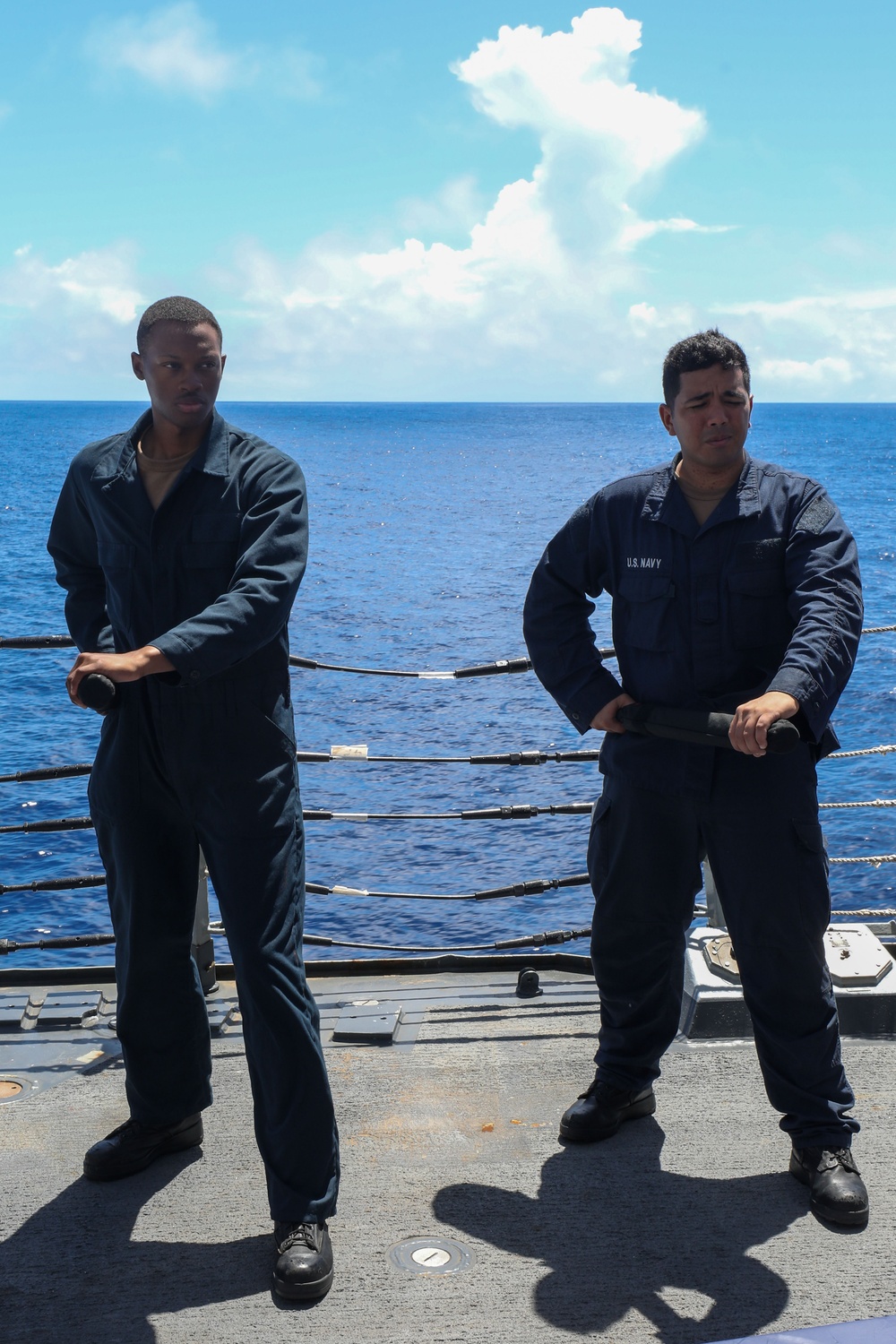Sailors aboard the USS John Finn conduct a security reaction force class in the Philippine Sea
