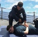 Sailors aboard the USS John Finn conduct a security reaction force class in the Philippine Sea