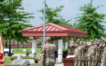 Soldiers salute the flag