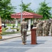 Soldiers salute the flag