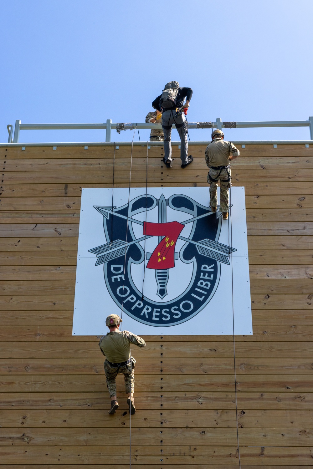 Rappelling with man's best teammate
