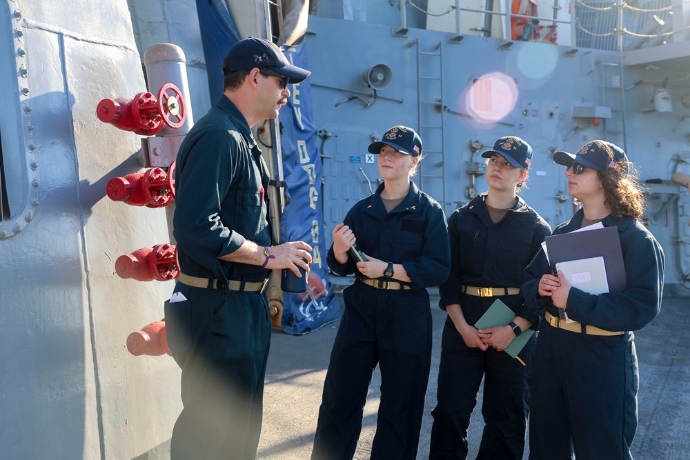LTJG Brandon Sleik provides initial topside familiarization to Midshipman