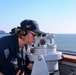 QMSN Lisa Gourlay uses an alidade to verify vector contact bearing