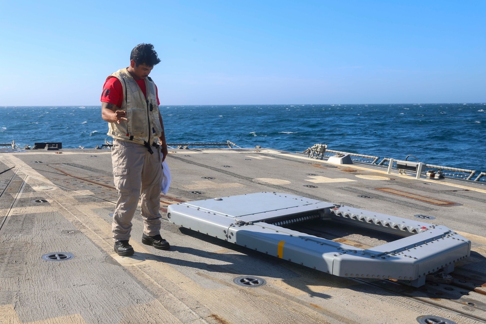 BMC Evandare Aganon aligns the rapid securing device during flight operations