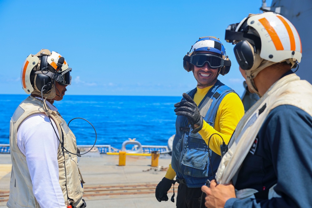 BMC Evandare Aganon, BM1 Jason Carpenter and BM1 Youssef Belakbir discuss their plan of action