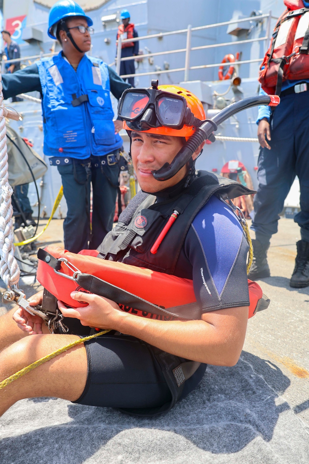 STGSN Nathan Antepara prepares to jump into the water