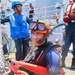 STGSN Nathan Antepara prepares to jump into the water