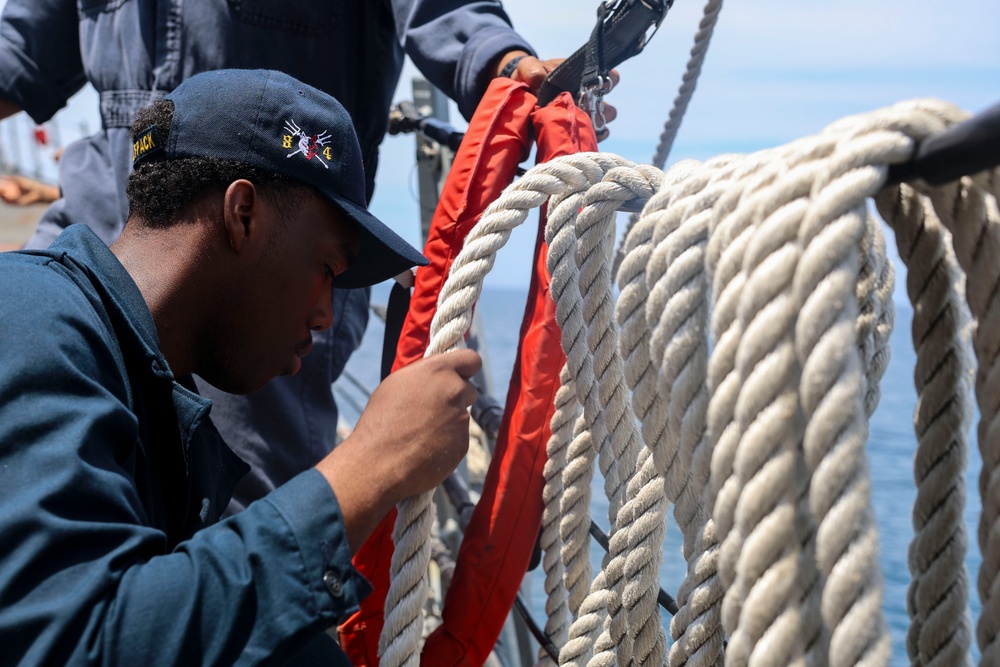 SR Connor Bailey  rigs the search and rescue davit lines