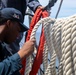 SR Connor Bailey  rigs the search and rescue davit lines