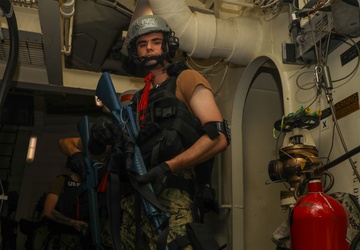 Sailors aboard the USS John Finn conduct a visit, board, search, and seizure drill in the Philippine Sea