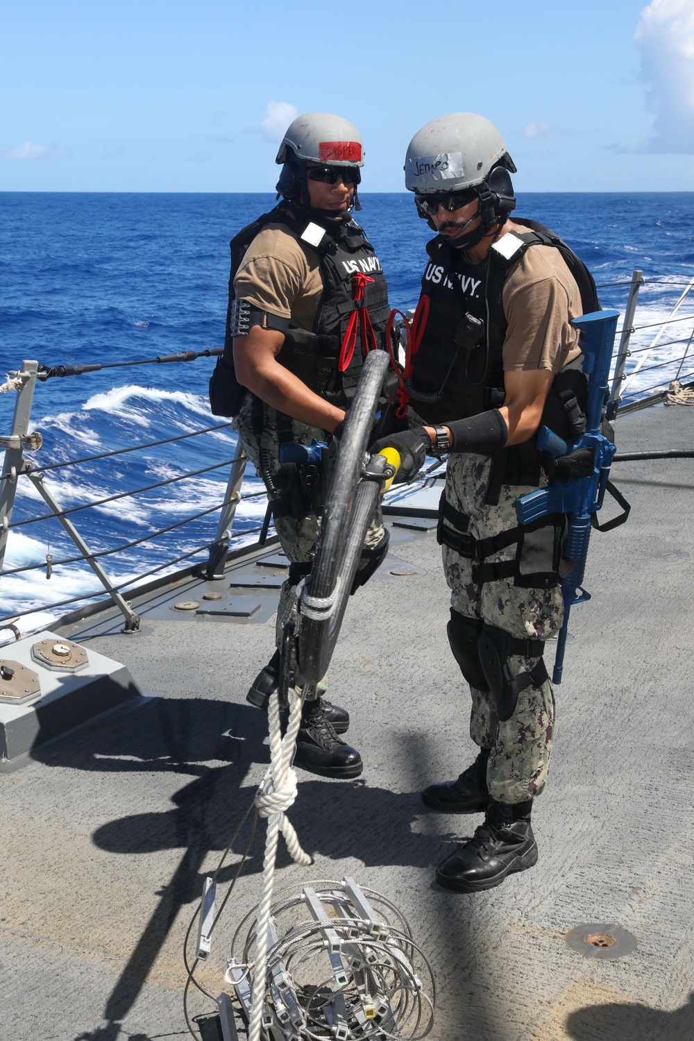 Sailors aboard the USS John Finn conduct a visit, board, search and seizure drill in the Philippine Sea