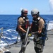 Sailors aboard the USS John Finn conduct a visit, board, search and seizure drill in the Philippine Sea