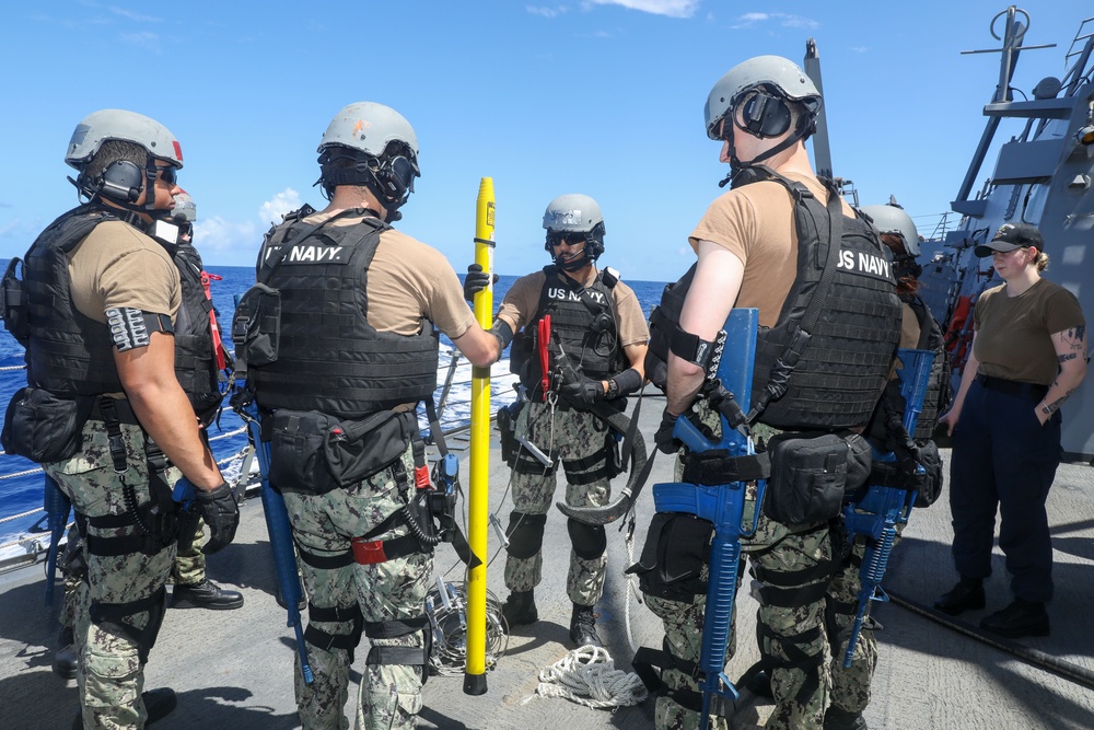 Sailors aboard the USS John Finn conduct a a visit, board, search and seizure drill in the Philippine Sea