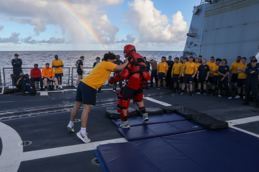 Sailors aboard the USS John Finn hold a security reaction force class in the Philippine Sea