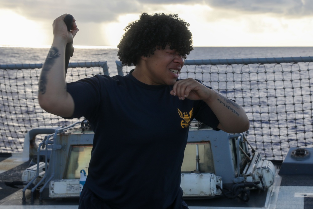 Sailors aboard the USS John Finn hold a security reaction force class in the Philippine Sea