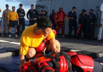 Sailors aboard the USS John Finn hold a security reaction force class in the Philippine Sea