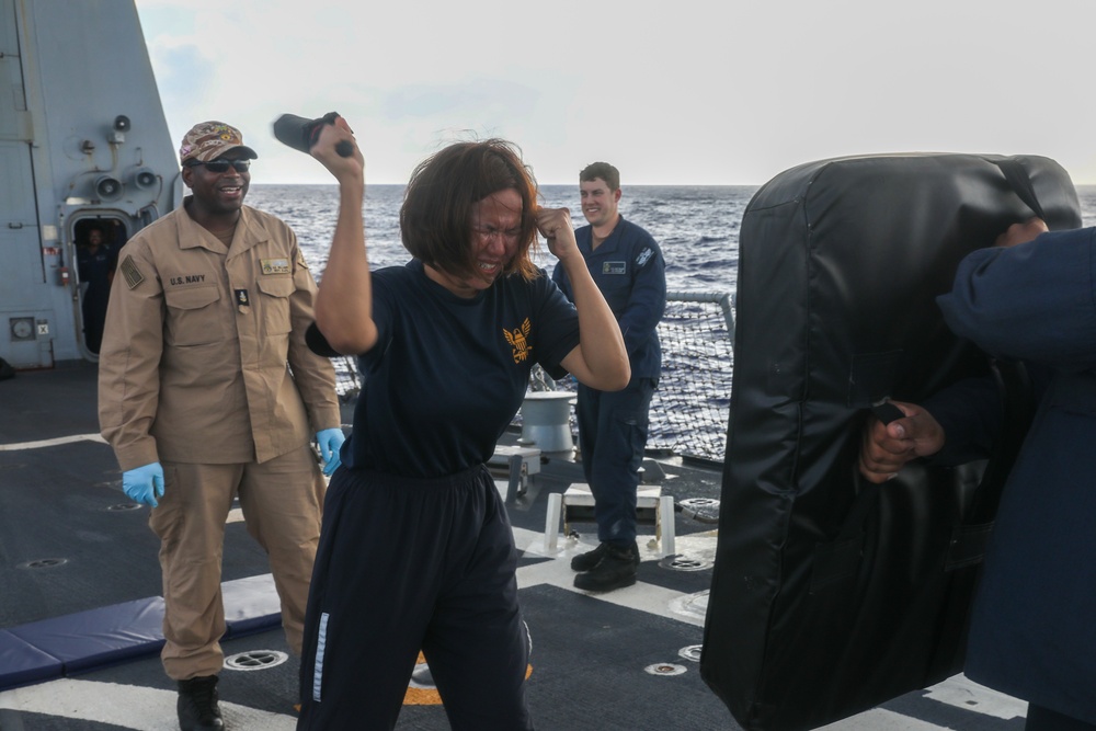 Sailors aboard the USS John Finn hold a security reaction force class in the Philippine Sea