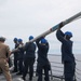 Sailors aboard the USS John Finn conduct a sea and anchor detail in Apra Harbor, Guam