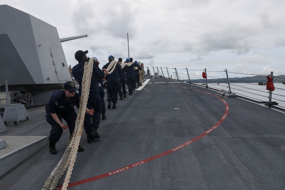 Sailors aboard the USS John Finn conduct a sea and anchor detail in Apra Harbor, Guam