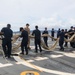Sailors aboard the USS John Finn conduct a sea and anchor detail in Apra Harbor, Guam
