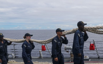 Sailors aboard the USS John Finn conduct a sea and anchor detail in Apra Harbor, Guam