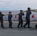 Sailors aboard the USS John Finn conduct a sea and anchor detail in Apra Harbor, Guam