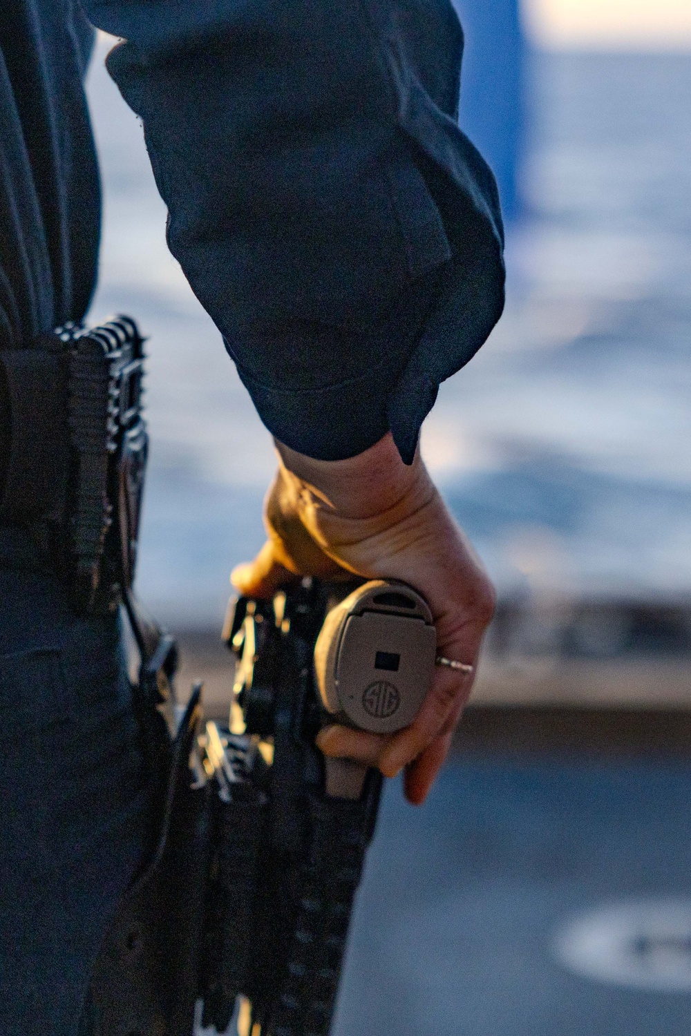 USS Ralph Johnson Sailors Participate in a Small Arms Weapons Qualification