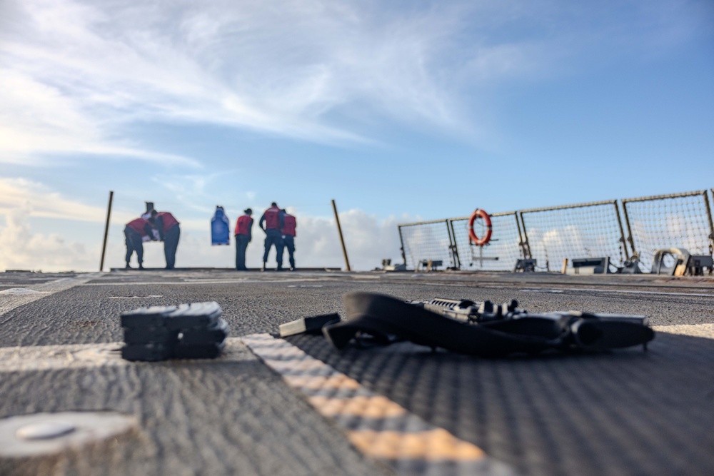 USS Ralph Johnson Sailors Participate in a Small Arms Weapons Qualification