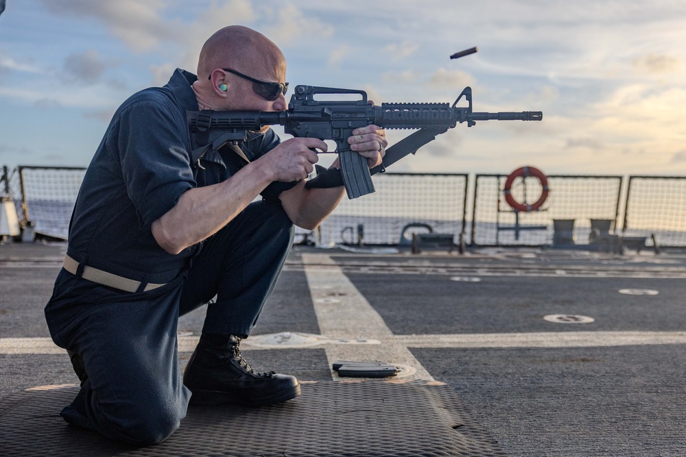 USS Ralph Johnson Sailors Participate in a Small Arms Weapons Qualification