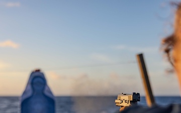USS Ralph Johnson Sailors Participate in a Small Arms Weapons Qualification