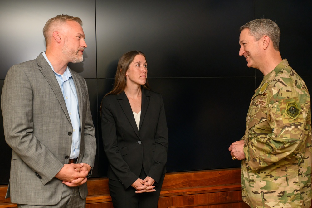 CJCS Gen. Caine greets and presents coins U.S. Africa Command team members
