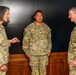 CJCS Gen. Caine greets and presents coins U.S. Africa Command team members