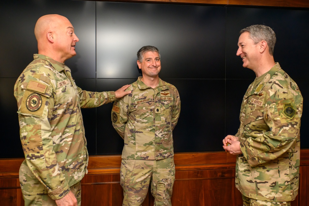 CJCS Gen. Caine greets and presents coins U.S. Africa Command team members
