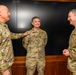 CJCS Gen. Caine greets and presents coins U.S. Africa Command team members