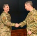 CJCS Gen. Caine greets and presents coins U.S. Africa Command team members