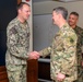 CJCS Gen. Caine greets and presents coins U.S. Africa Command team members