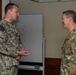 CJCS Gen. Caine greets and presents coins U.S. Africa Command team members