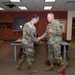 Col. Power Coins Kirtland combat arms instructors