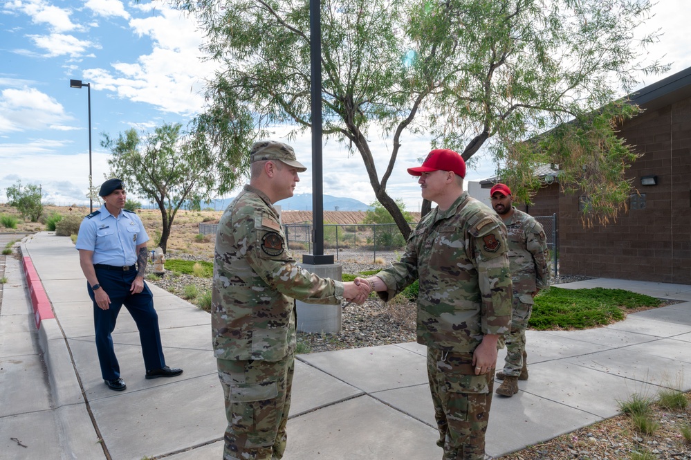 Col. Power Coins Kirtland combat arms instructors