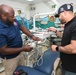 U.S. Navy biomedical technicians collaborate with Panamanian hospital staff to restore dental equipment