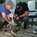 U.S. Navy biomedical technicians collaborate with Panamanian hospital staff to restore dental equipment