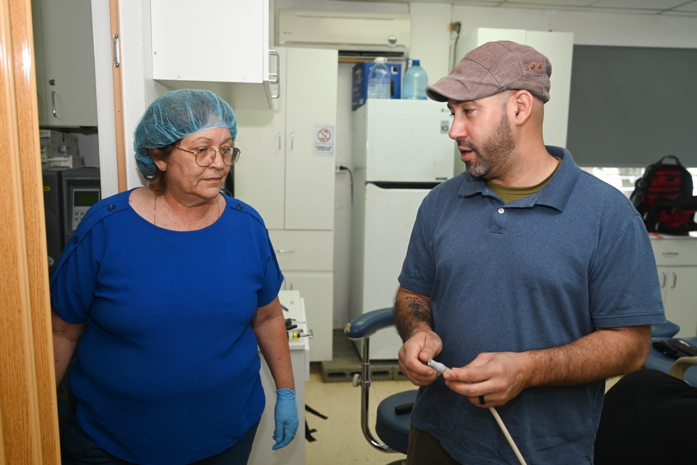 U.S. Navy biomedical technicians collaborate with Panamanian hospital staff to restore dental equipment