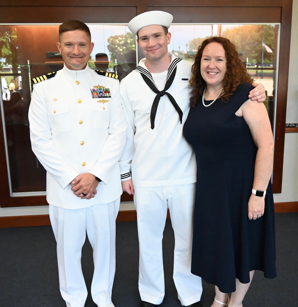 Commanding Officer Surface Combat Systems Training Command Great Lakes is the reviewing officer of Ron's boot camp graduation.