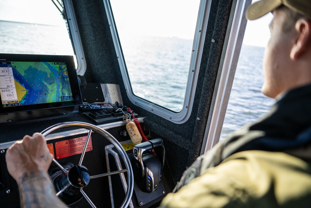 Securing the Seas: 6th Security Forces Marine Patrol on Duty
