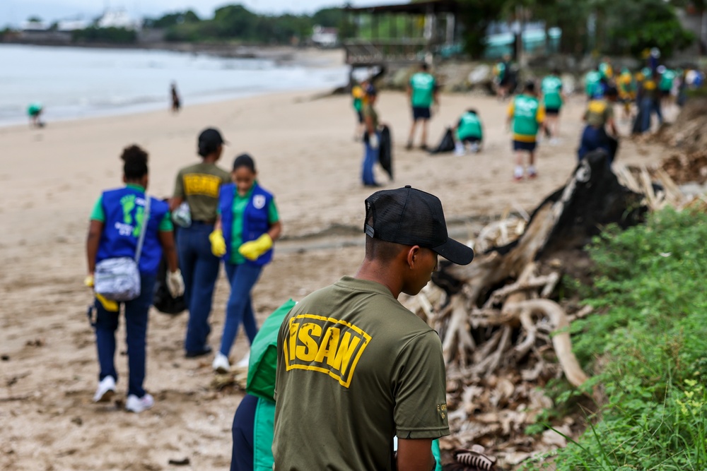 U.S. Navy Sailors clean up litter on a beach in Panama