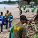 U.S. Navy Sailors clean up litter on a beach in Panama