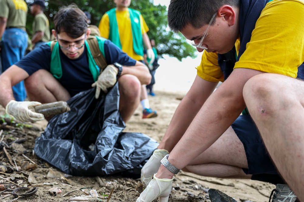 U.S. Navy Sailors clean up litter on a beach in Panama