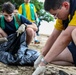 U.S. Navy Sailors clean up litter on a beach in Panama