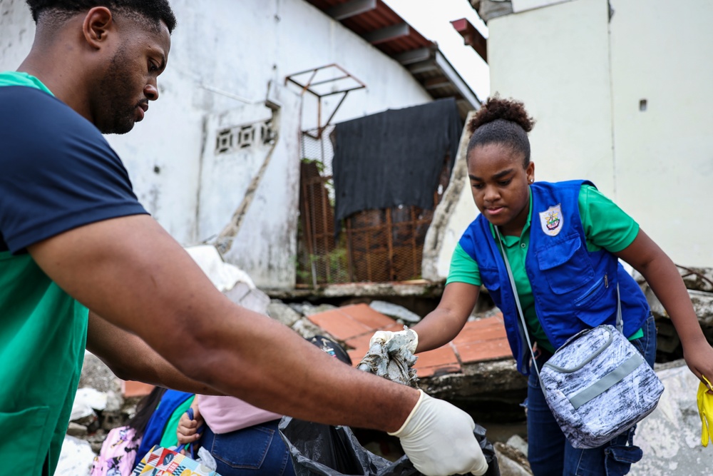 U.S. Navy Sailors clean up litter on a beach in Panama