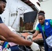 U.S. Navy Sailors clean up litter on a beach in Panama